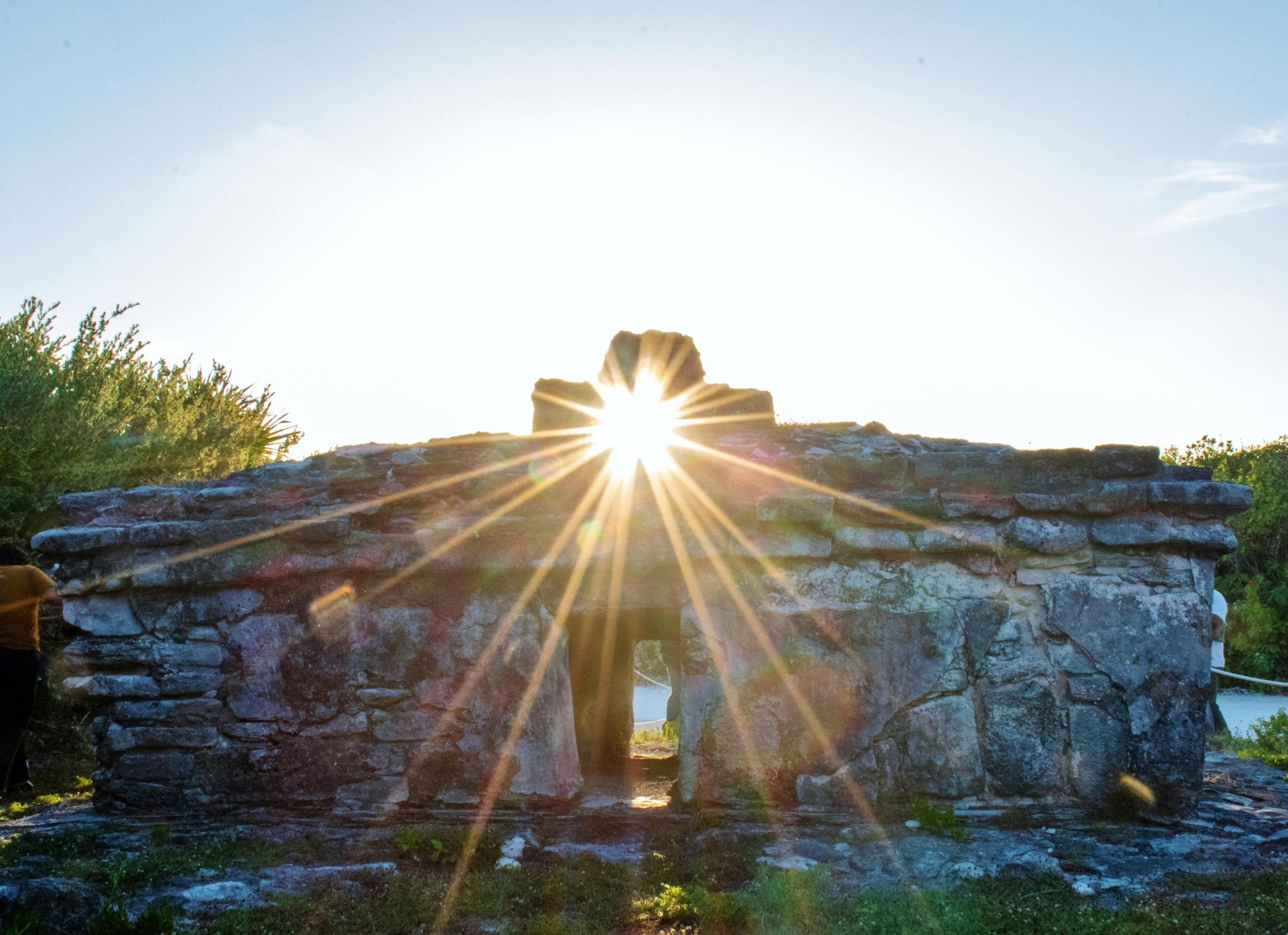 Sunlight passing through an opening in an old stone building.